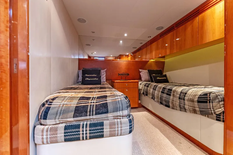 Slide: The Image of Interior cabin of 2007 Hatteras 64 Convertible yacht with twin beds and plaid bedding. - 23