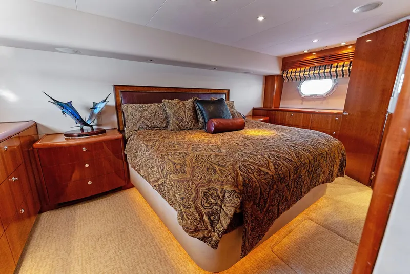 Slide: The Image of Luxurious bedroom interior of 2007 Hatteras 64 Convertible yacht with elegant bedding. - 26
