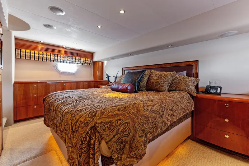 Slide: The Image of Luxurious bedroom interior of 2007 Hatteras 64 Convertible yacht with elegant bedding. - 28