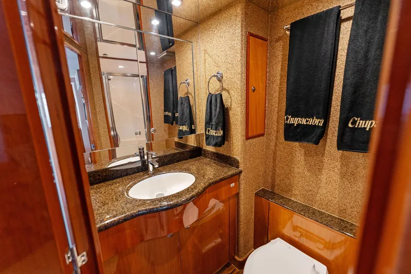 Slide: The Image of Luxurious bathroom in 2007 Hatteras 64 Convertible yacht with granite countertop. - 30