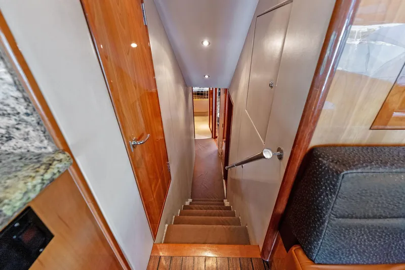 Slide: The Image of Interior stairs of a 2007 Hatteras 64 Convertible yacht. - 31