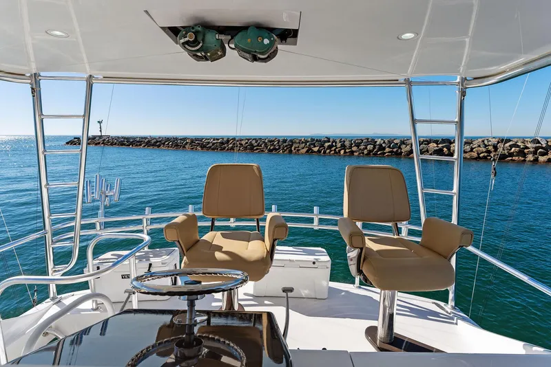 Slide: The Image of 2007 Hatteras 64 Convertible yacht helm with ocean view. - 32