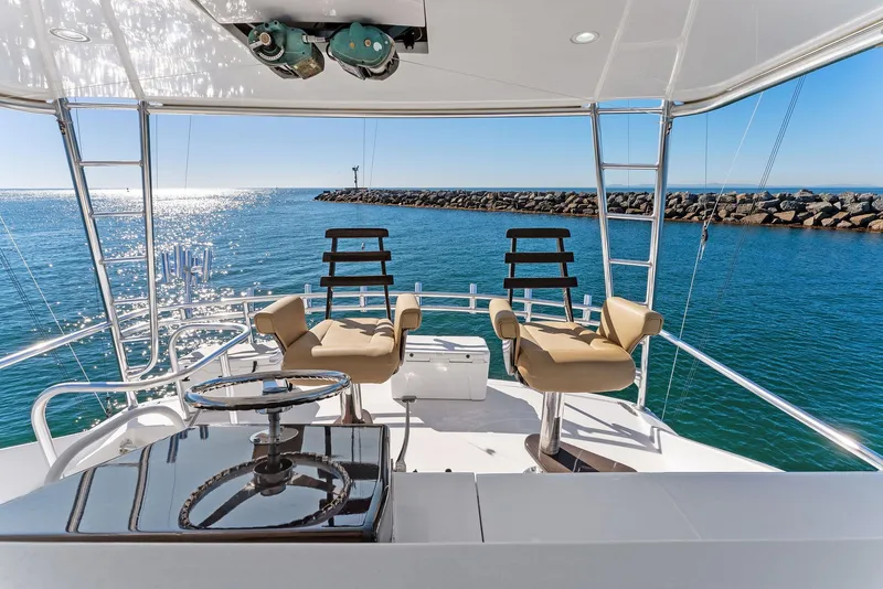 Slide: The Image of 2007 Hatteras 64 Convertible yacht helm station with ocean view. - 35