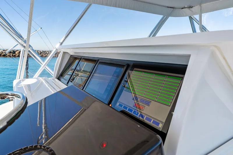 Slide: The Image of Hatteras 64 Convertible 2007 yacht helm with advanced navigation screens. - 39