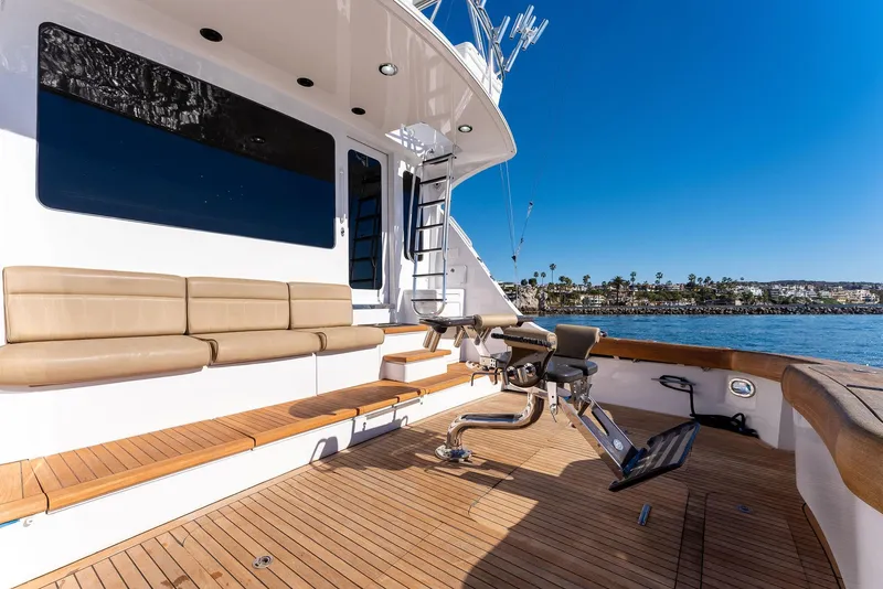 Slide: The Image of 2007 Hatteras 64 Convertible yacht deck with seating and fishing chair. - 47