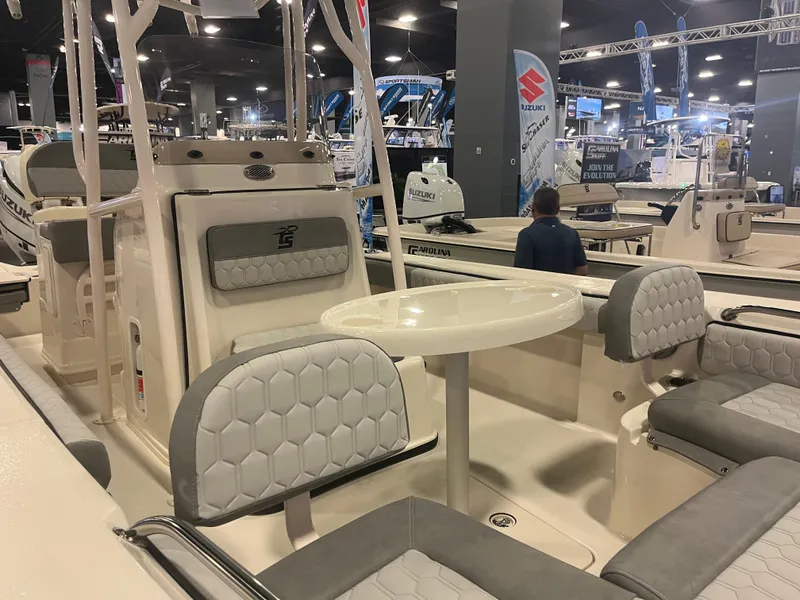 Slide: The Image of 2024 Carolina Skiff 24 Ultra Elite boat interior at a boat show. - 18