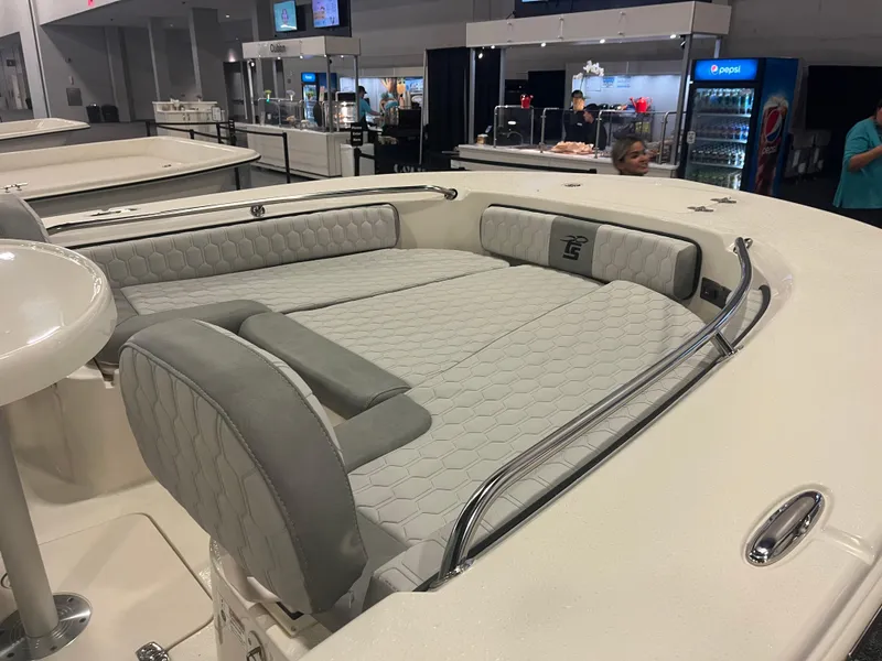 Slide: The Image of 2024 Carolina Skiff 24 Ultra Elite boat interior with cushioned seating and modern design. - 19