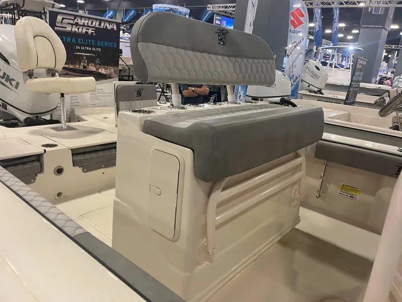 Slide: The Image of 2024 Carolina Skiff 24 Ultra Elite boat interior with seating and storage. - 20