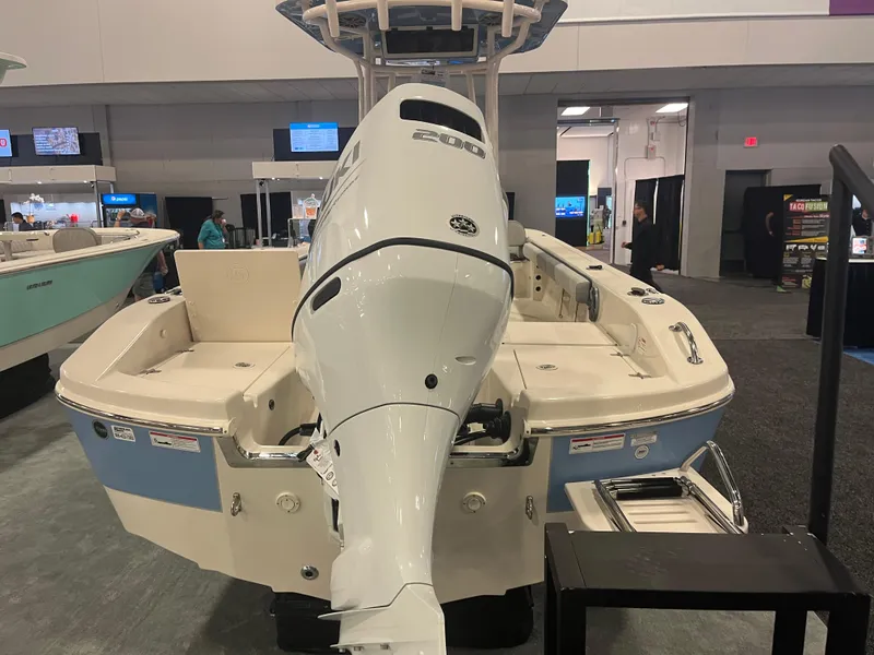 Slide: The Image of 2024 Carolina Skiff 22 Ultra Elite boat displayed at an indoor exhibition. - 11