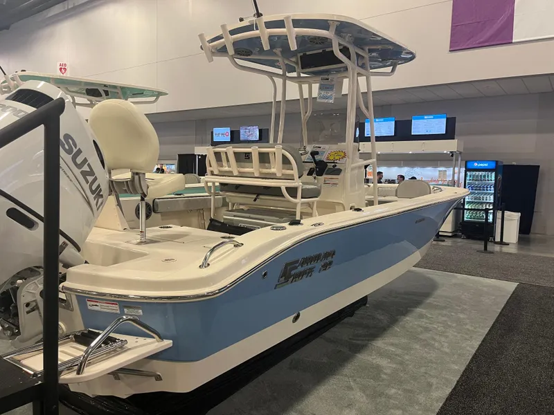 Slide: The Image of 2024 Carolina Skiff 22 Ultra Elite boat on display indoors. - 21