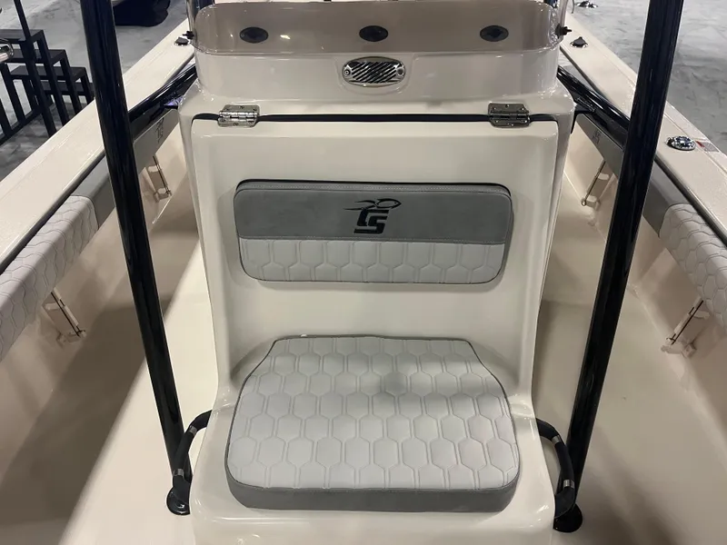 Slide: The Image of 2024 Carolina Skiff 22 Ultra Elite boat seating area with cushioned backrest and seat. - 23