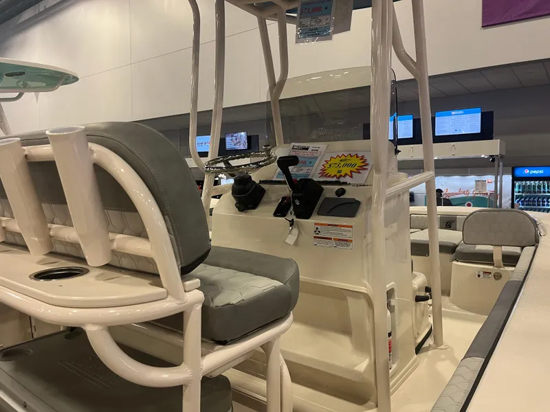 Slide: The Image of 2024 Carolina Skiff 22 Ultra Elite boat interior with seating and control console. - 7