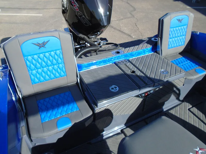 Slide: The Image of 2024 Vexus DVX20S boat interior with blue and gray seating and storage compartments. - 19