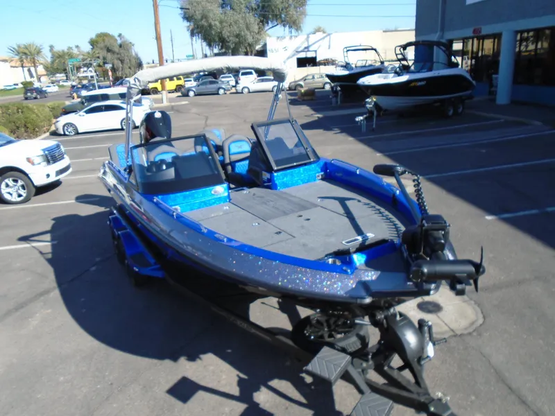 Slide: The Image of 2024 Vexus DVX20S fishing boat in a parking lot. - 20
