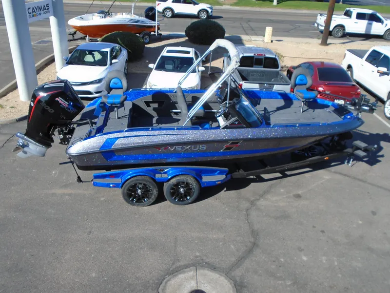 Slide: The Image of 2024 Vexus DVX20S blue fishing boat on trailer in parking lot. - 23