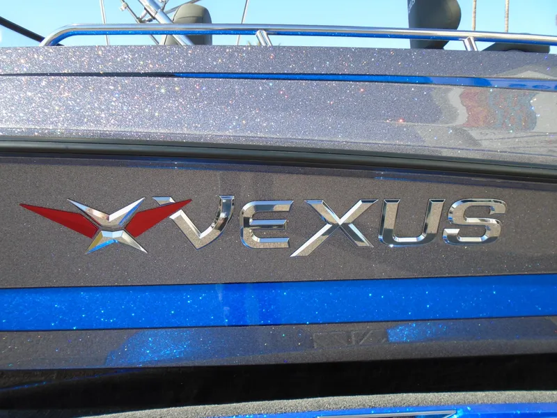 Slide: The Image of 2024 Vexus DVX20S boat logo with metallic finish. - 24