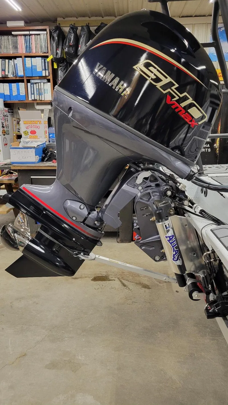 Slide: The Image of 2025 Xpress Skiff 185 with Yamaha Vmax 115 SHO outboard motor in a workshop. - 14