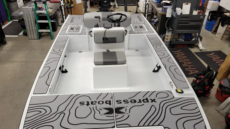 Slide: The Image of 2025 Xpress Skiff 185 with Yamaha Vmax 115 SHO, showcased in a workshop setting. - 8