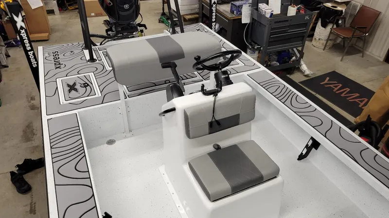 Slide: The Image of 2025 Xpress Skiff 185 with Yamaha Vmax 115 SHO, interior view in workshop. - 9