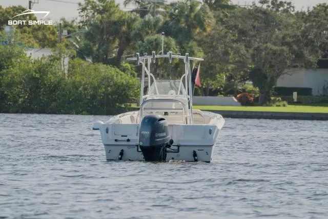 Slide: The Image of 2023 Sailfish 220 CC boat on water, rear view. - 3
