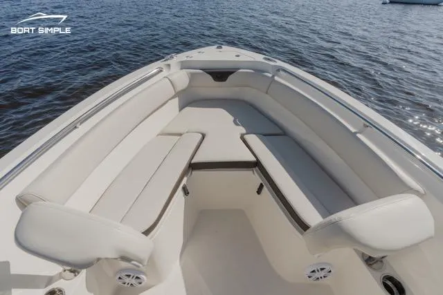 Slide: The Image of 2023 Sailfish 220 CC boat interior with cushioned seating. - 4