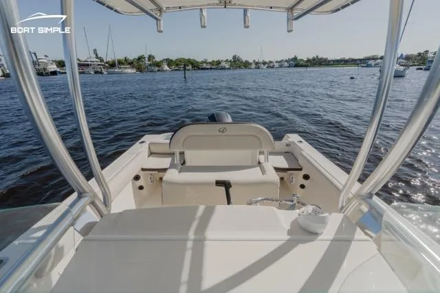 Slide: The Image of 2023 Sailfish 220 CC boat interior with waterfront view. - 8