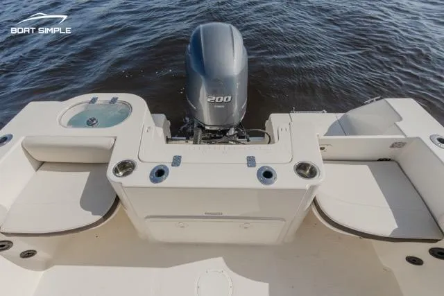 Slide: The Image of 2023 Sailfish 220 CC boat stern with outboard motor and seating. - 9