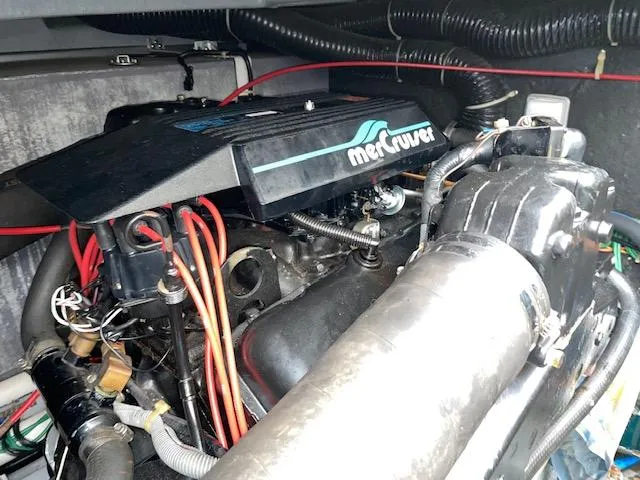 Slide: The Image of 1989 Sea Ray 390 Express Cruiser engine compartment with MerCruiser components. - 14