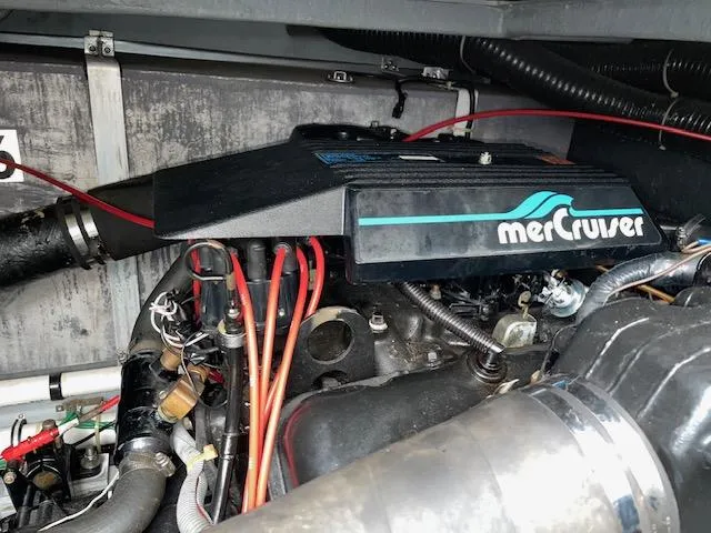 Slide: The Image of Engine compartment of a 1989 Sea Ray 390 Express Cruiser with MerCruiser components. - 16