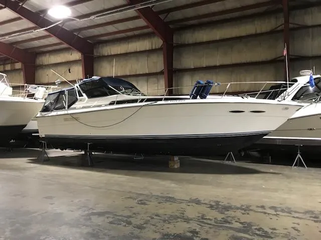 Slide: The Image of 1989 Sea Ray 390 Express Cruiser in indoor storage. - 20