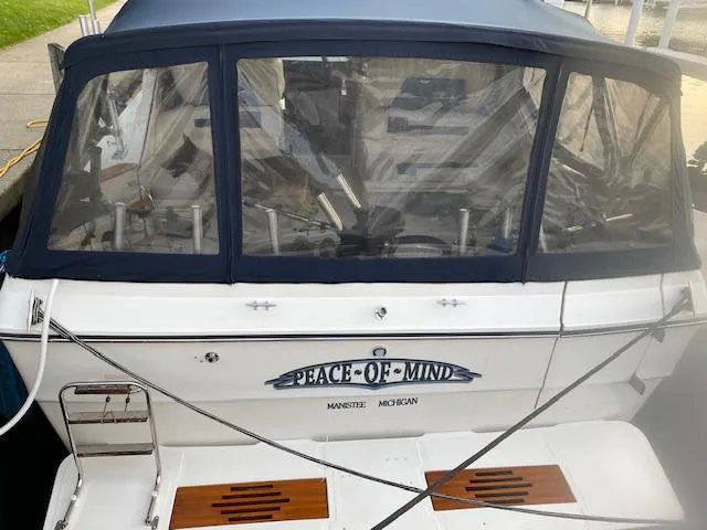 Slide: The Image of 1989 Sea Ray 390 Express Cruiser docked, named Peace of Mind, Manistee, Michigan. - 6