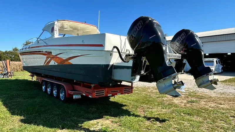 Slide: The Image of 2009 Eliminator 47' Cat boat on trailer with twin outboard engines. - 3