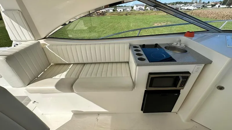 Slide: The Image of 2009 Eliminator 47' Cat interior with kitchenette and seating area. - 9
