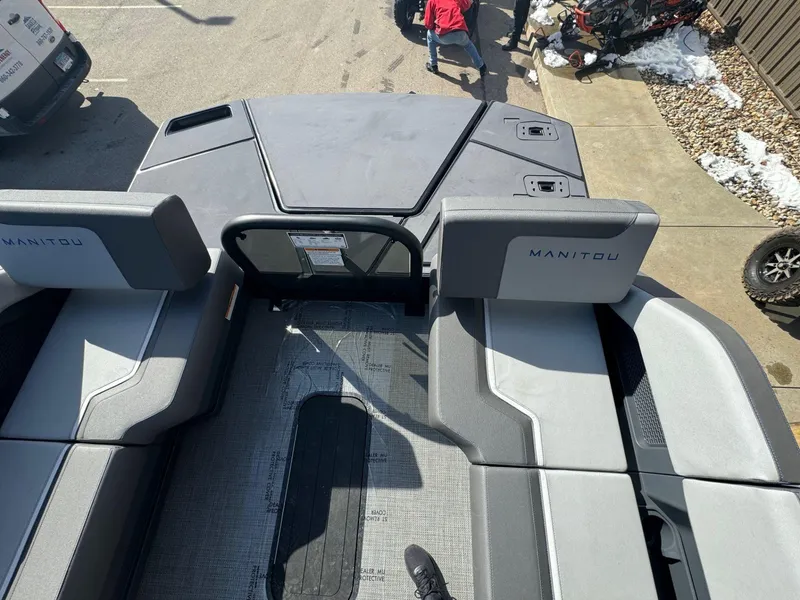 Slide: The Image of 2024 Manitou Cruise 22 Max Bench interior view with gray seating. - 10