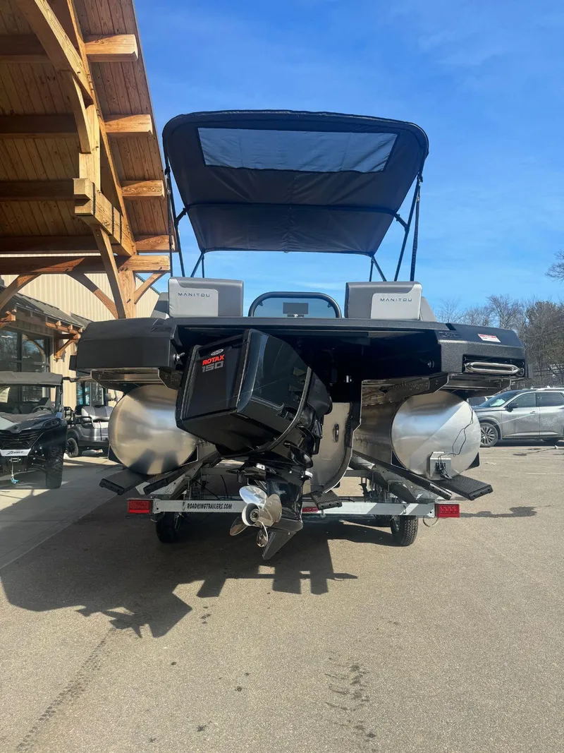 Slide: The Image of 2024 Manitou Cruise 22 Max Bench pontoon boat with outboard motor. - 4
