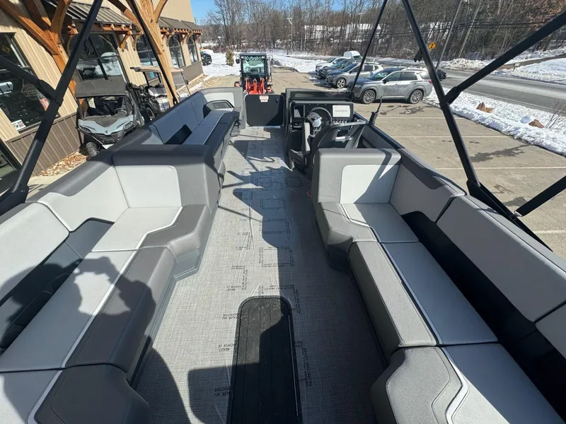 Slide: The Image of 2024 Manitou Cruise 22 Max Bench pontoon boat interior with spacious seating. - 9