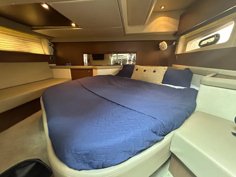 Slide: The Image of Luxurious cabin interior of 2014 Sea Ray 370 Venture with cozy bed and modern decor. - 20