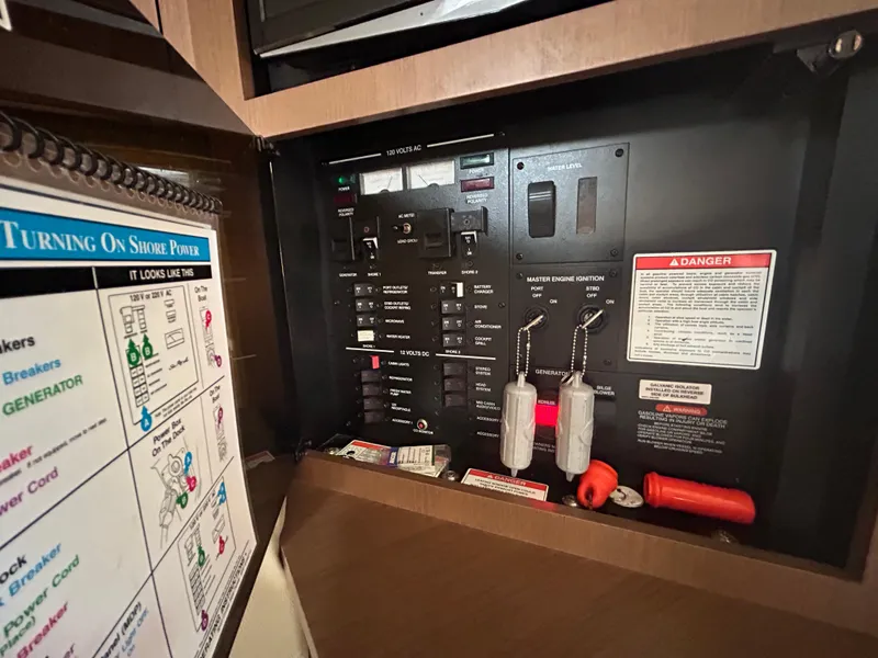 Slide: The Image of Electrical control panel of a 2014 Sea Ray 370 Venture boat. - 23
