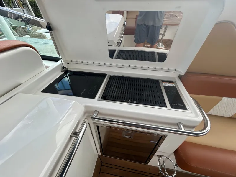 Slide: The Image of 2014 Sea Ray 370 Venture boat galley with grill and sink. - 28
