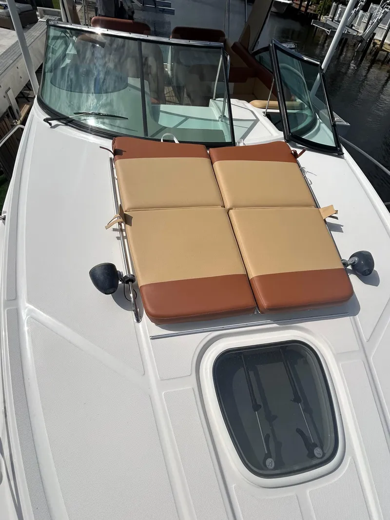 Slide: The Image of 2014 Sea Ray 370 Venture boat with sun pads on deck. - 32