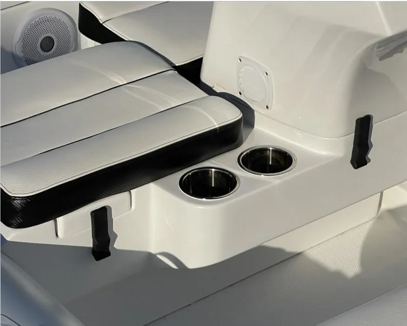 Slide: The Image of 2024 Walker Bay Generation 13 LTE boat interior with cup holders and seating. - 7