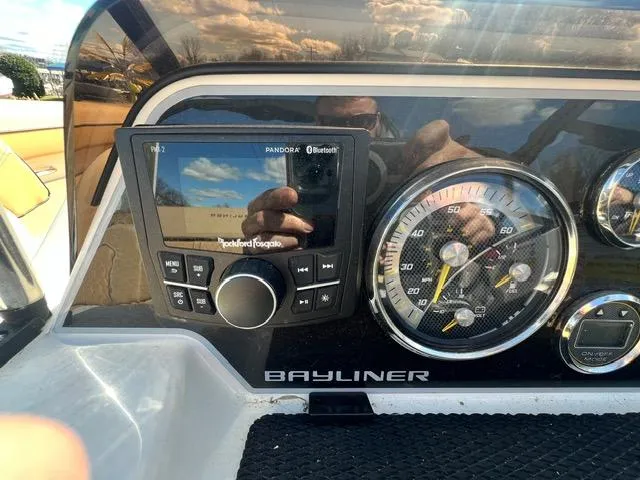 Slide: The Image of Bayliner DX 2050 dashboard with Rockford Fosgate stereo and speedometer, 2023 model. - 16