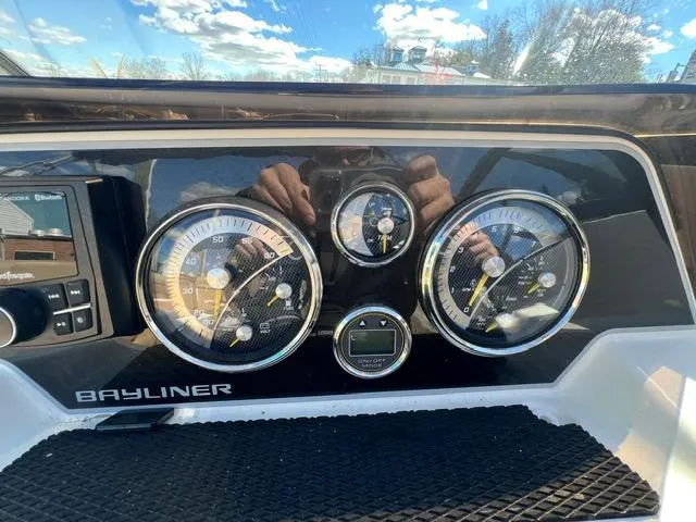 Slide: The Image of Dashboard of 2023 Bayliner DX 2050 boat with gauges and controls. - 17