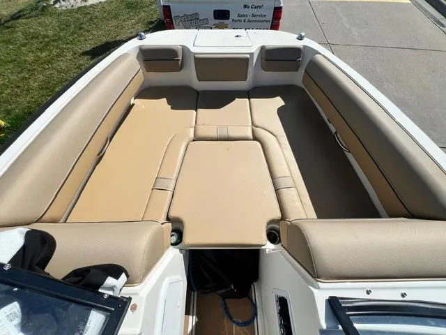 Slide: The Image of 2023 Bayliner DX 2050 boat with spacious tan seating area. - 20