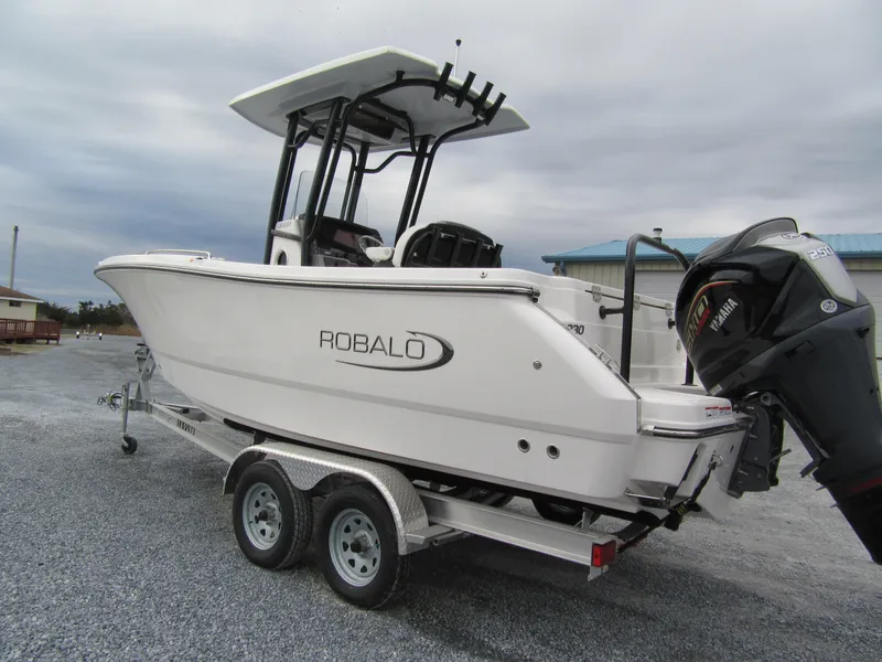 Slide: The Image of 2024 Robalo R230 Center Console boat on trailer, side view. - 3