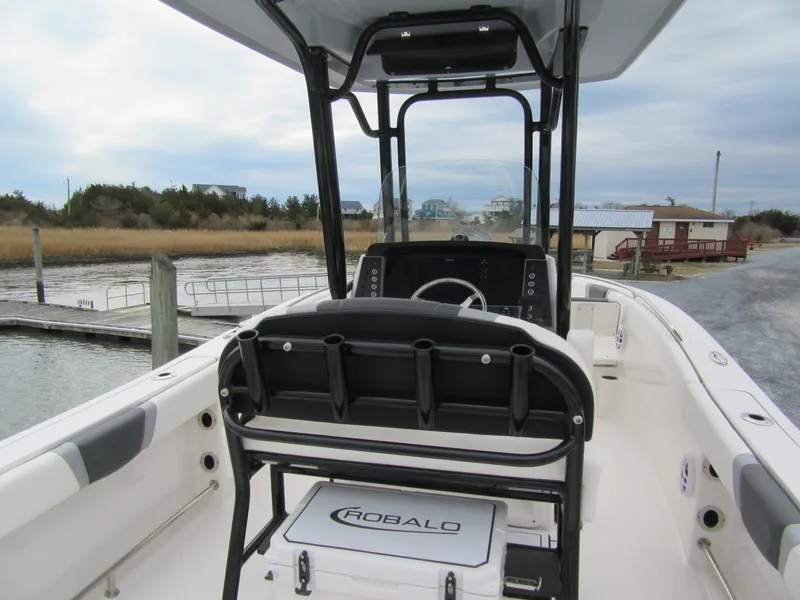 Slide: The Image of 2024 Robalo R230 Center Console boat interior at a dockside location. - 5