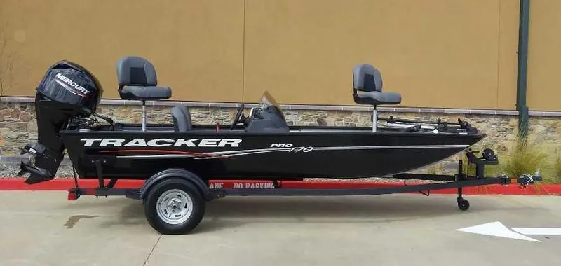 Slide: The Image of 2024 Tracker Pro 170 fishing boat on trailer with Mercury outboard motor. - 4