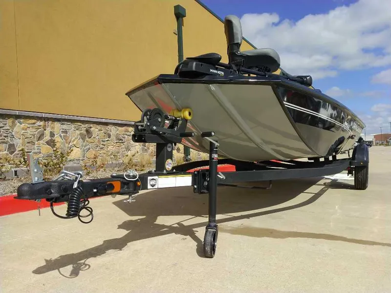 Slide: The Image of 2024 Tracker Pro 170 boat on trailer, parked outdoors. - 8