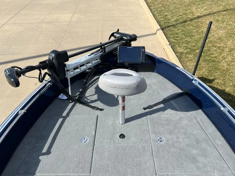 Slide: The Image of 2024 Nitro ZV21 boat deck with fishing seat, trolling motor, and fish finder. - 2