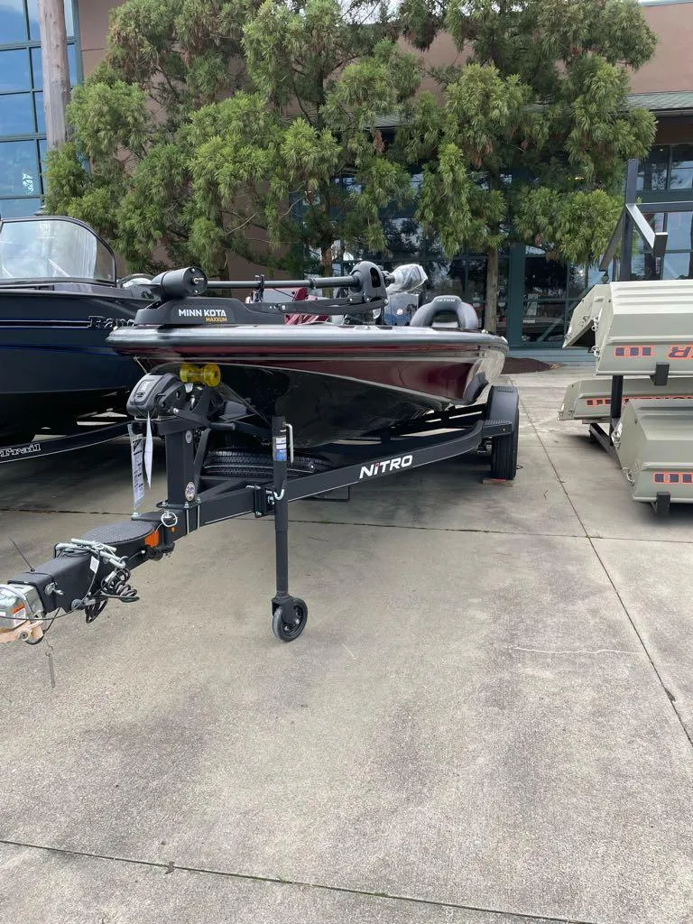 Slide: The Image of 2024 Nitro Z18 boat on a trailer, parked outdoors. - 4